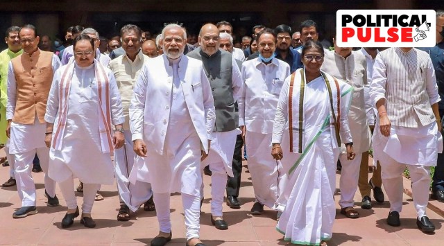 NDA's candidate Droupadi Murmu, accompanied by Prime Minister Narendra Modi, Union Ministers Rajnath Singh, Amit Shah, BJP President J P Nadda and other dignitaries, walks towards Parliament House to file her nomination papers for presidential election, in New Delhi. (PTI, file)