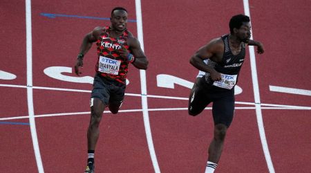 Ferdinand Omanyala, left, of Kenya, runs in a heat of the men's 100-meter run at the World Athletics Championships Friday, July 15, 2022, in Eugene, Ore.(AP Photo/Gregory Bull)