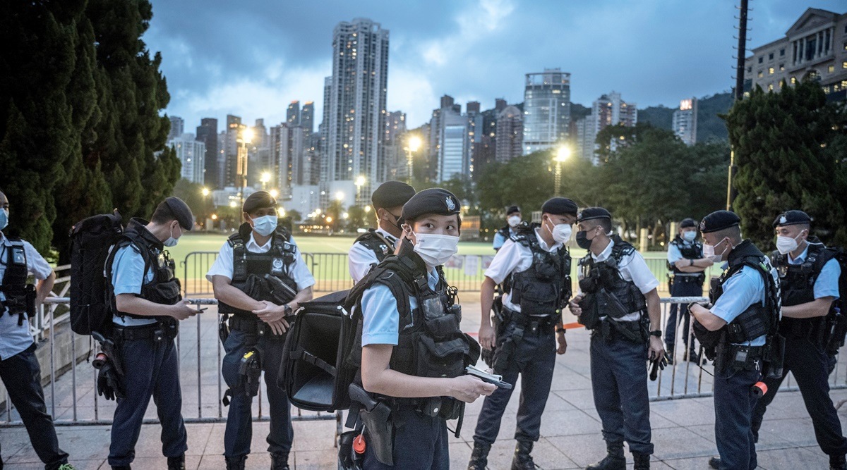 Police officers standing guard in front of the closed Victoria Park, in anticipation of the anniversary of the 1989 Tiananmen Square protests, in Hong Kong, on June 4, 2022. (Sergey Ponomarev/The New York Times)
