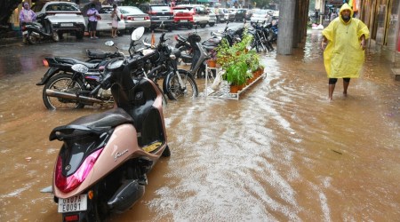 A man wades through a waterlogged street in Panaji on Thursday. (Photo: PTI)