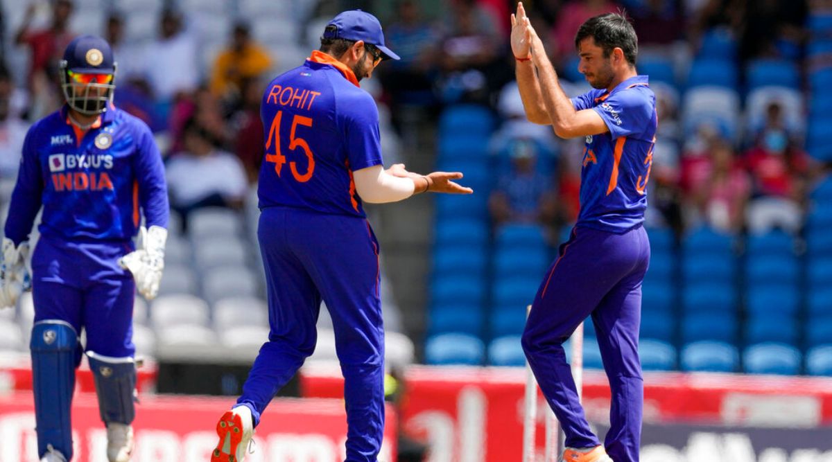 India's Ravi Bishnoi celebrates with captain Rohit Sharma after he bowled West Indies' Rovman Powell during the first T20 cricket match at Brian Lara Cricket Academy in Tarouba, Trinidad and Tobago, Friday, July 29, 2022. (AP Photo/Ricardo Mazalan)