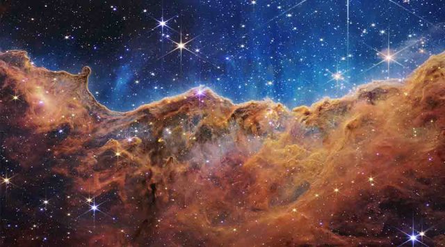 The edge of a young, star-forming region called NGC 3324 in the Carina Nebula captured in infrared light by NASA’s new James Webb Space Telescope. (Image credit: NASA, ESA, CSA, and STScI)