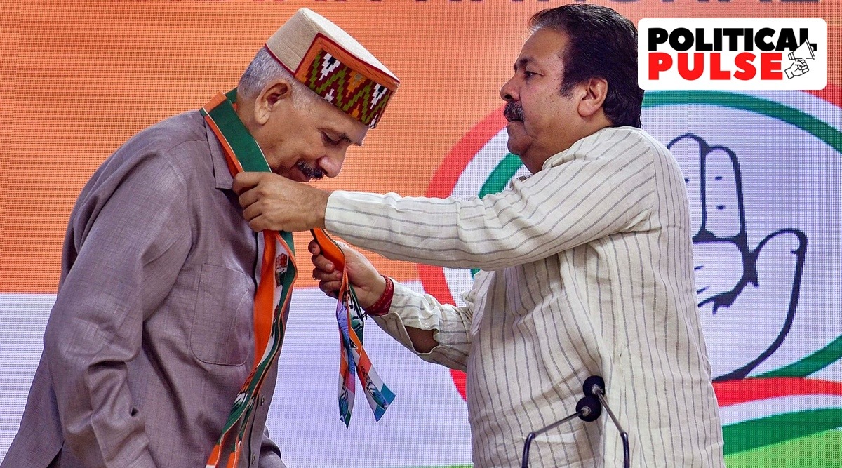 Former Himachal Pradesh BJP president Khimi Ram being felicitated by AICC in-charge of the state Rajeev Shukla as he joins Congress, at AICC headquarters in New Delhi, Tuesday. (PTI)