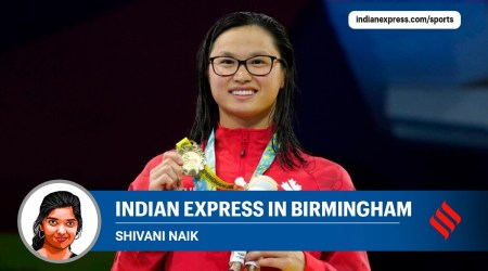 Margaret Mac Neil of Canada poses with her medal after winning the Women's 100 meters butterfly final during the Commonwealth Games at the Sandwell Aquatics Centre in Birmingham, England, Saturday, July 30, 2022. (AP Photo/Kirsty Wigglesworth)