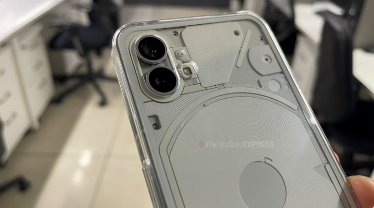 Nothing phone (1) in white is seen along with the transparent back