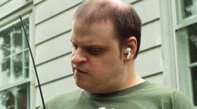 In this photo, Patrick Perdue, a radio enthusiast who is blind, at his home in Queens.