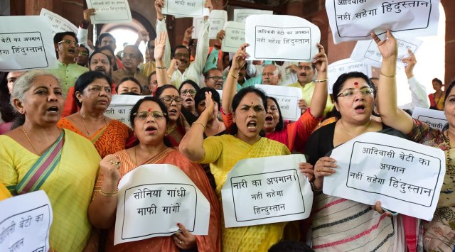 Union Finance Minister Nirmala Sitharaman with other BJP MPs during a protest against Congress leader Adhir Ranjan Chowdhury's remarks on President Droupadi Murmu at Parliament House. (PTI)