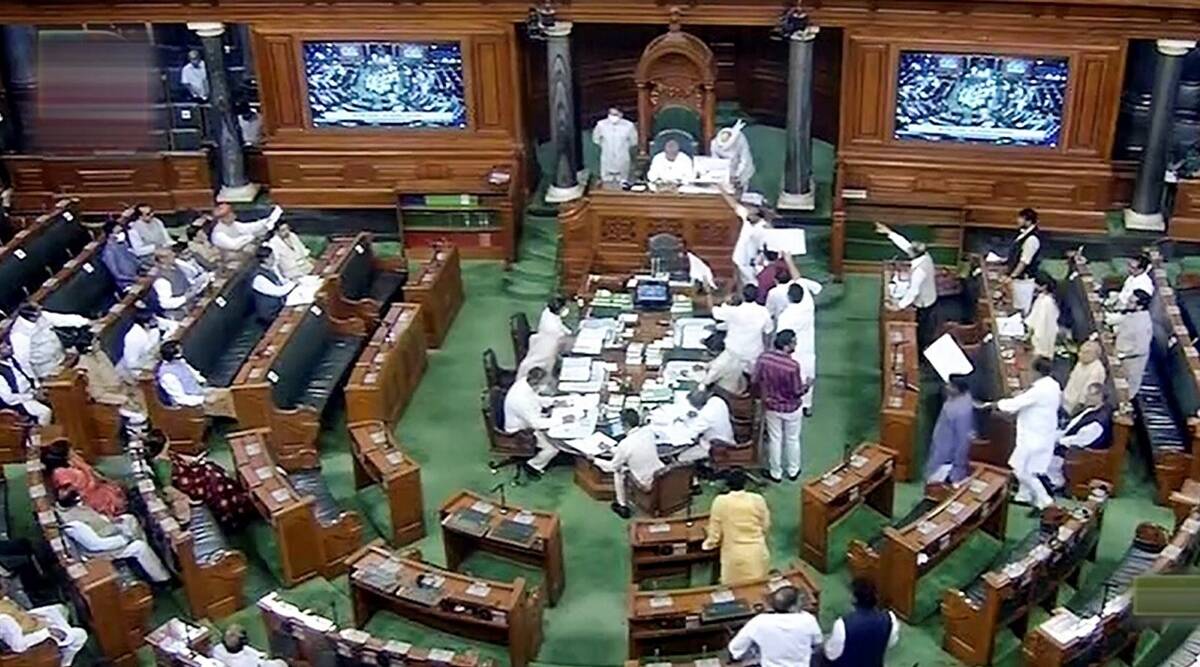 Opposition members stage a protest in the well of the Lok Sabha during Monsoon Session of Parliament, in New Delhi, July 18, 2022. (SANSAD TV/PTI)
