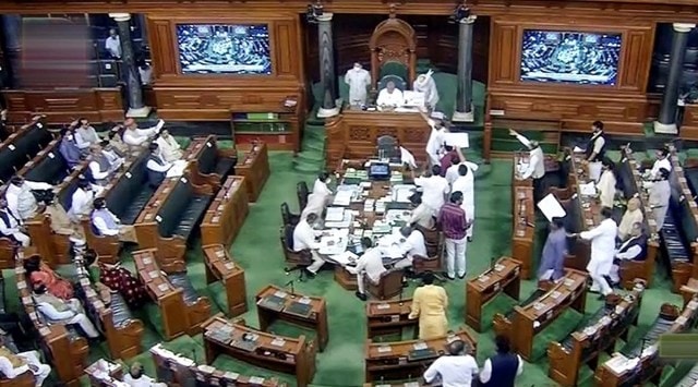 Opposition members stage a protest in the well of the Lok Sabha during Monsoon Session of Parliament, in New Delhi, July 18, 2022. (SANSAD TV/PTI)
