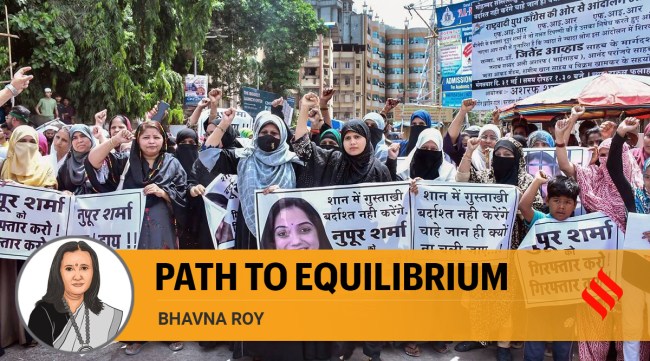 Women from the Muslim community shout slogans during their protest against suspended BJP spokesperson Nupur Sharma over her alleged remarks on Prophet Mohammad, in Thane. (PTI)