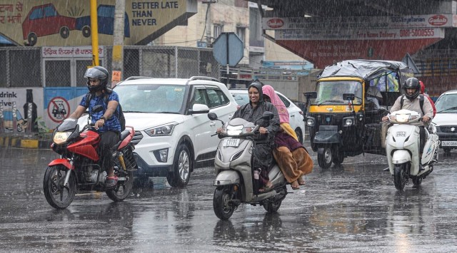 Vehicles ply during monsoon rain in Jalandhar, July 15, 2022. (PTI)