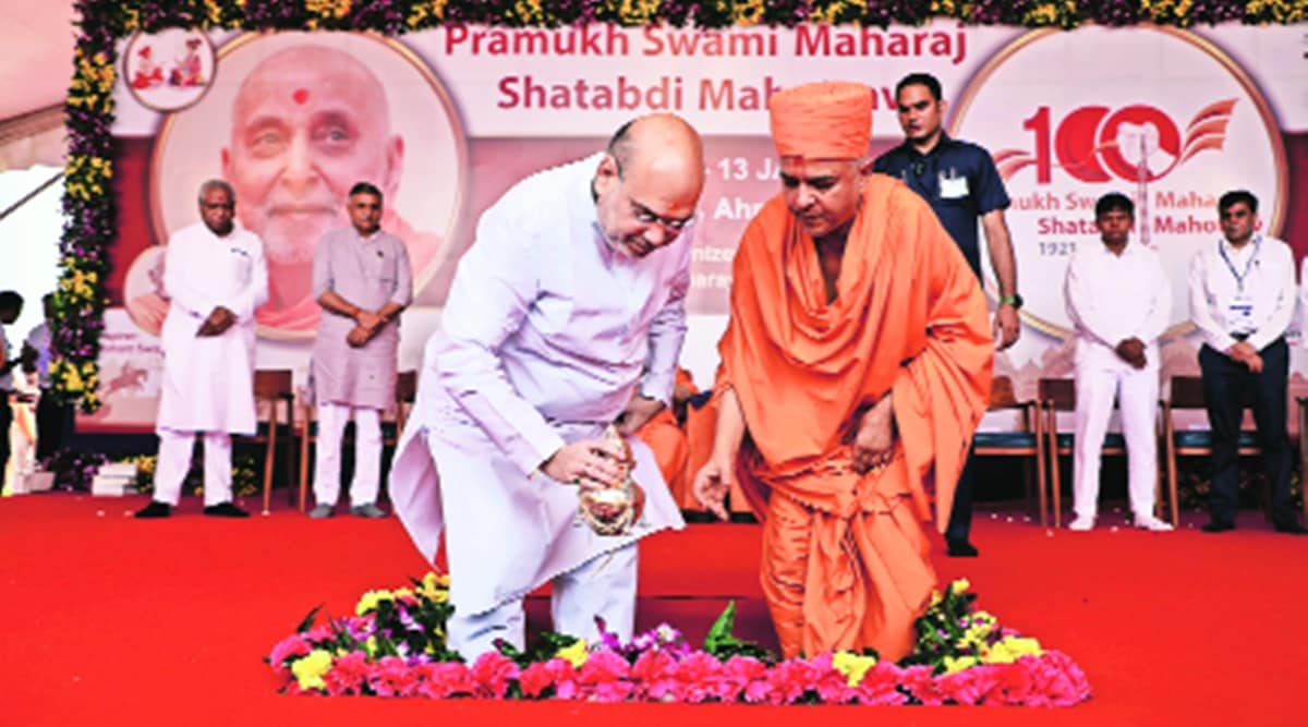 Union Minister Amit Shah at Pramukh Swami Maharaj Shatabdi Mahotsav programme in Ahmedabad Sunday. (Express photo)