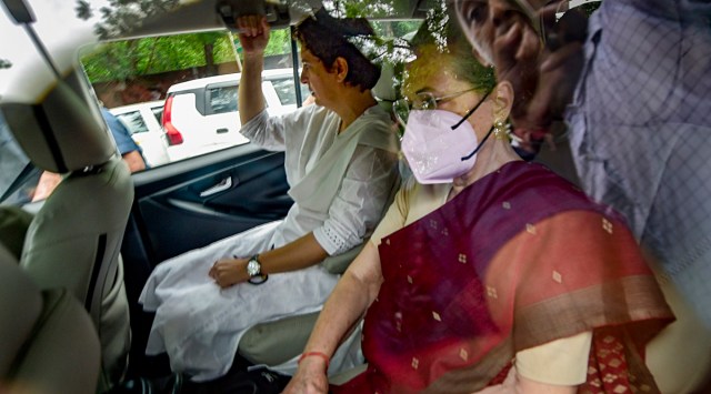 Congress President Sonia Gandhi with party General Secretary Priyanka Gandhi arrives to appear before the Enforcement Directorate for questioning in connection with the National Herald case, in New Delhi. (PTI)