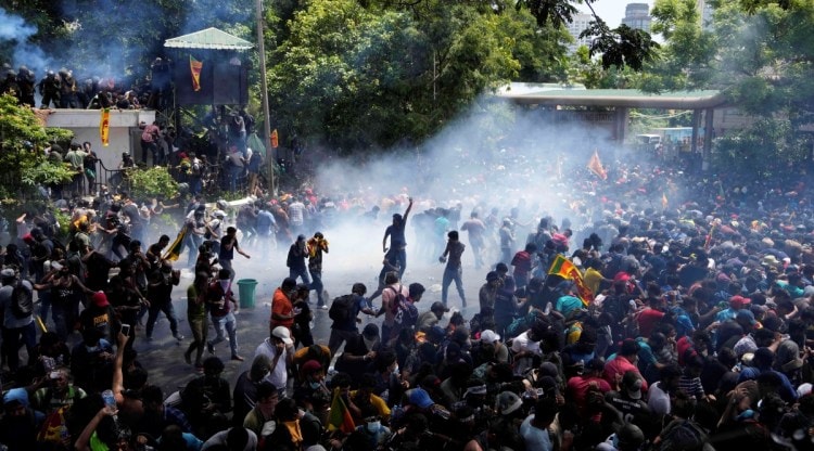 Police use tear gas to disperse the protesters who stormed the compound of prime minister Ranil Wickremesinghe 's office, demanding he resign after president Gotabaya Rajapaksa fled the country amid economic crisis in Colombo, Sri Lanka, Wednesday, July 13, 2022. (AP)