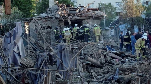 Rescue specialists work at the site of a destroyed residential building after the blasts in Belgorod, Russia, July 3, 2022. (REUTERS)