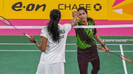 ndian shuttler Pusarla Venkata Sindhu greets Shahzad Mahoor of Pakistan in group league match of Commonwealth Games 2022, at National Exhibition Centre(NEC) in Birmingham,UK. (PTI)