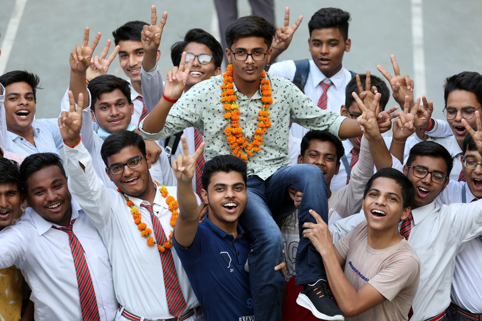 Students of Rani Laxmi Bai Memorial School hold a celebration after ICSE class 10th result in Lucknow on Sunday. (Express photo by Vishal Srivastav)