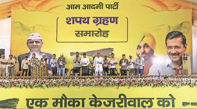 AAP workers take oath in Solan on Monday. (Express Photo)