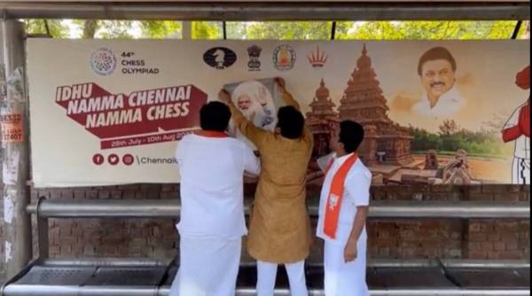 Amar Prasad Reddy, president of sports and skill development cell of Tamil Nadu BJP, released a video clip of him fixing photographs of Modi on hoardings, along with two others. He posted the clip on his twitter handle. (Twitter/@AmarReddy)