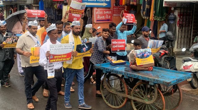 AAP workers hit the streets in different cities of Gujarat in protest, following which they were briefly detained by the police. (Twitter/AAP Gujarat)