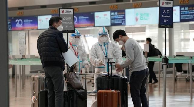 In February 2021, major US airlines adopted voluntary international contact tracing months after the White House under then-President Donald Trump blocked mandatory collection. (AP)