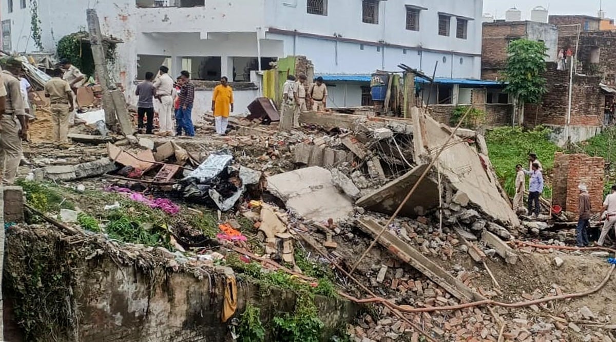 Police personnel inspect after a blast at a firecracker factory in Khoibagh market at Chapra in Saran district, July 24, 2022. (PTI Photo)