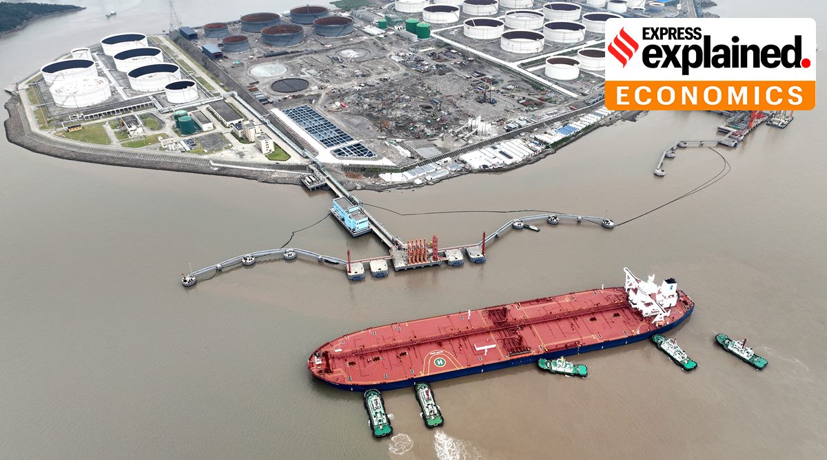 An aerial view shows tugboats helping a crude oil tanker to berth at an oil terminal in China. (cnsphoto via Reuters) 