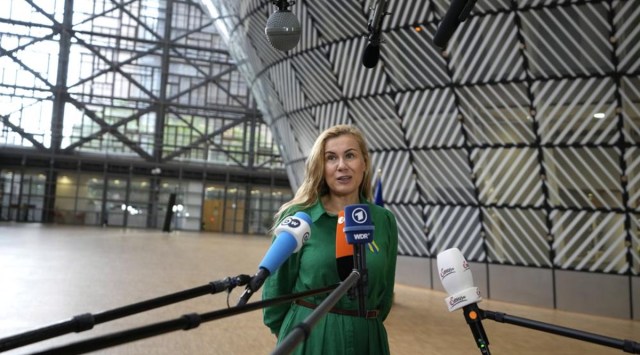 European Commissioner for Energy Kadri Simson speaks with the media as she arrives for an emergency meeting of EU energy ministers in Brussels on Tuesday, July 26, 2022. European Union governments Tuesday neared an agreement on rationing natural gas this winter to protect against any further supply cuts by Russia. (AP Photo/Virginia Mayo)