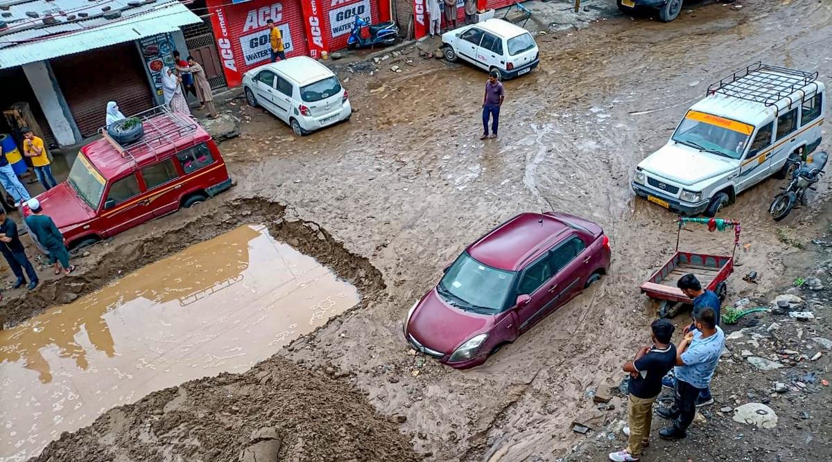Vehicles stuck on a damaged road after a cloudburst at Gunti forest uphill of Thathri Town in Doda district, Saturday, July 9, 2022. (PTI Photo)  
