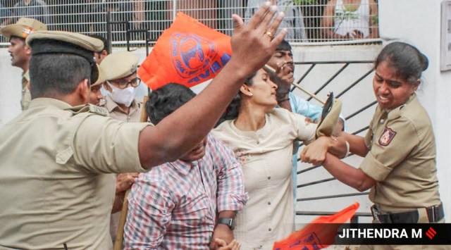 Police personnel detain ABVP activists as they protest at the residence of Karnataka Home Minister Araga Jnanendra seeking 'justice' for BJP youth wing leader Praveen Nettar, who was murdered in Dakshina Kannada district, in Bengaluru, July 30, 2022. (Express photo)