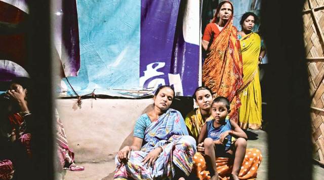 Family members of Swapan Majhi, one of the slain TMC workers, at Dharmatala village in Canning town. (Express photo by Partha Paul)