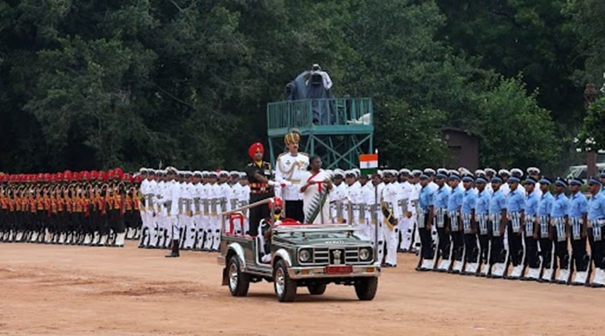 President Droupadi Murmu reviews a guard of honour at the forecourt of the Rashtrapati Bhavan on Monday. (Express Photo by Renuka Puri)