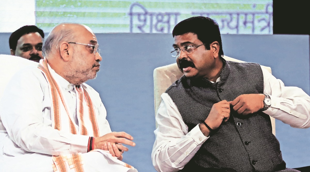 Union Ministers Amit Shah with Dharmendra Pradhan at the National Education policy 2020 celebrating after Compeleted two years in new Delhi on Friday.  (Express photo by Prem nath Pandey)
