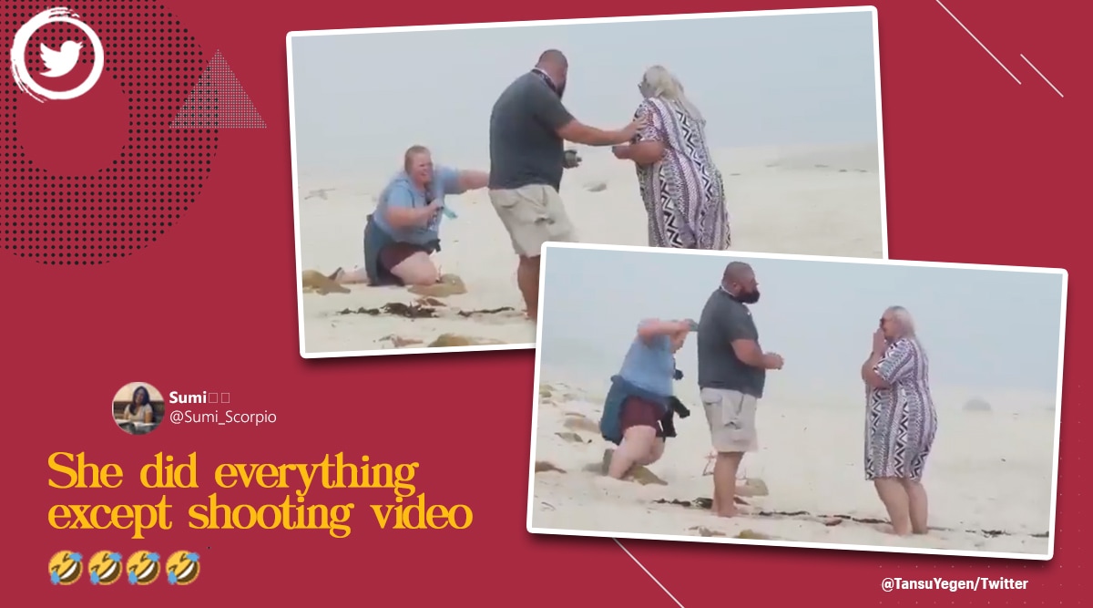 ‘You had one job’: Woman tumbles on the sand trying to capture couple’s wedding proposal
