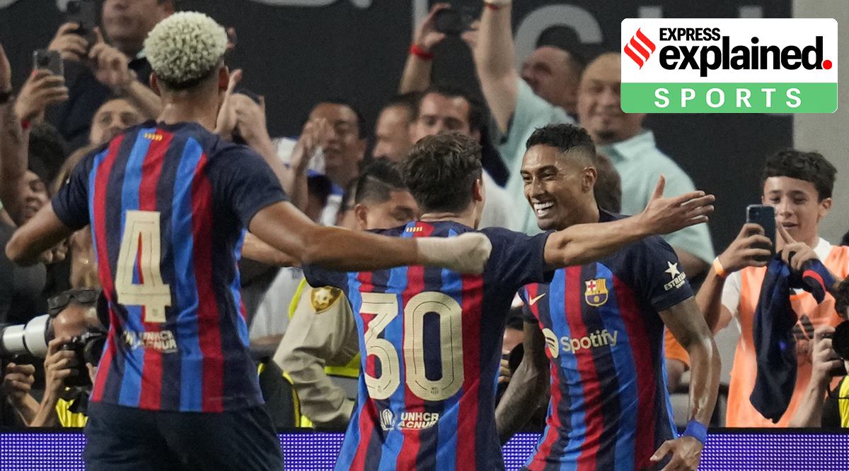 Barcelona's Raphael Dias, right, celebrates after scoring against Real Madrid during the first half of a friendly soccer match Saturday, July 23, 2022, in Las Vegas. (AP Photo/John Locher)
