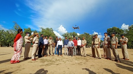 A drone is seen in flight as Tripura Police and BSF officials watch on. (Express photo by Debraj Deb)