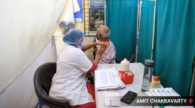 A health worker administers Covid-19 vaccine to a beneficiary in Mumbai. (Express file photo)
