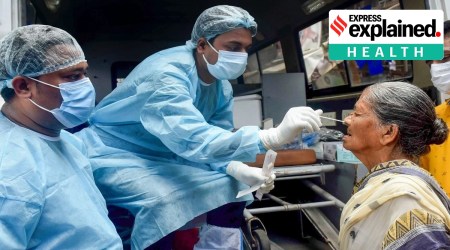 A healthcare worker takes a swab sample of a woman for Covid testing in Kolkata, July 4, 2022. (PTI)