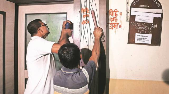 A CID team raids a trader's office close to Lalbazar police headquarters in Kolkata on Tuesday in connection with the case of Jharkhand MLAs’ arrest. (Express photo by Partha Paul)