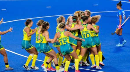 Australian players celebrate their win in the women's semifinal hockey match against India at the Commonwealth Games in Birmingham, England, Friday, Aug. 5, 2022. (AP Photo/Aijaz Rahi)