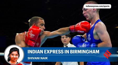 India's Amit Panghal, left, and Scotland's Lennon Mulligan in the Men's Fly (48-51kg) quarterfinal during the Commonwealth Games. (AP)