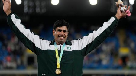 Arshad Nadeem of Pakistan poses on the podium after winning the gold medal in the Men's javelin throw during the athletics competition in the Alexander Stadium at the Commonwealth Games in Birmingham, England. (AP)