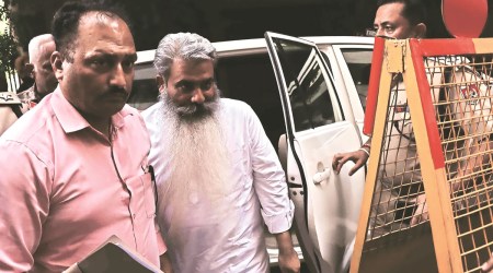 Bharat Bhushan Ashu being taken to court in Ludhiana on Saturday. (Express photo by Gurmeet Singh)