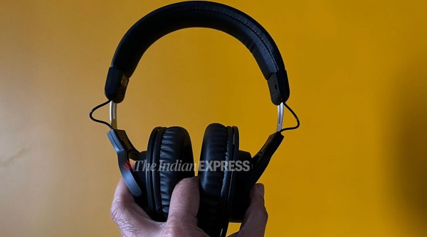 Audio Technika ATH M20X BT wireless headphones with a yellowish background