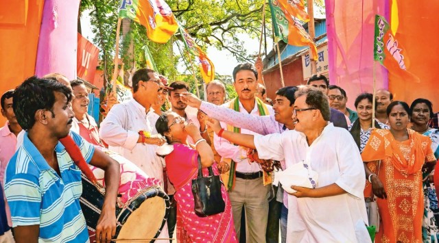 BJP activists celebrate after Central Bureau of Investigation (CBI) arrested TMC leader Anubrata Mondal in a cow smuggling case, at Balurghat in South Dinajpur district, Thursday, Aug. 11, 2022. (PTI Photo)