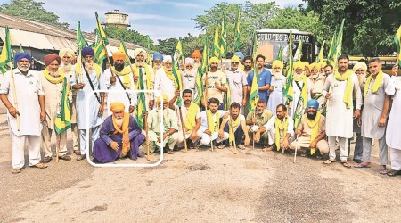 Balwinder Singh (in blue) at the farmers’ dharna site in Muktsar.  (Express Photo)