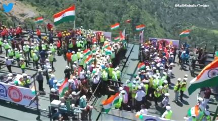 Watch: Workers hoist national flag on world’s highest arch bridge