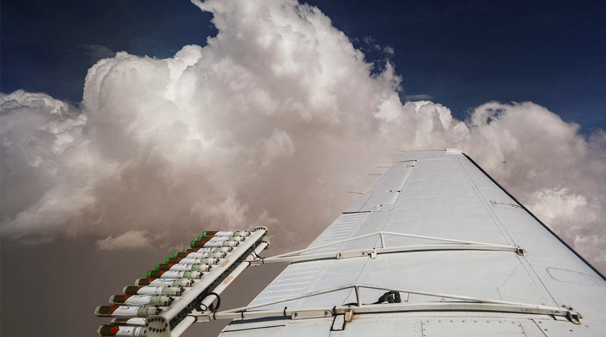 Hygroscopic flares are attached to an aircraft during a cloud seeding fligh