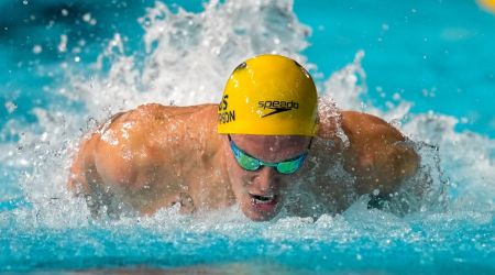 Cody Simpson of Australia swims in  100m butterfly heat during the swimming at the Commonwealth Games in the Sandwell Aquatics Centre in Birmingham, England. (AP)