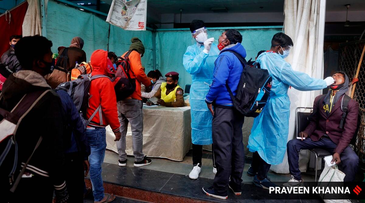 Passengers being tested for Covid-19 at Anand Vihar Railway Station in New Delhi. (Express photo by Praveen Khanna)